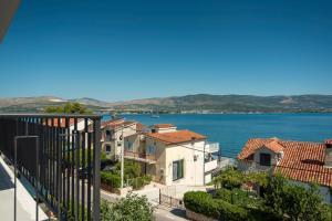 a view from a balcony of houses and the water at Luxury apartments Nicole in Trogir