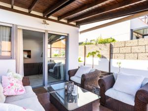 a living room with couches and a glass table at Live Barranco Hondo Crisanto in Candelaria