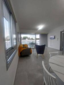 a living room with a couch and a table at Luxury 2 bedroom apartment in Larnaka