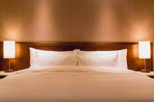Katil atau katil-katil dalam bilik di 家美瑞品 台北 - Jiamei Hotel