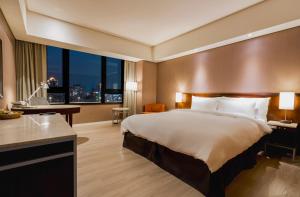 Katil atau katil-katil dalam bilik di 家美瑞品 台北 - Jiamei Hotel