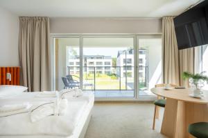 Postel nebo postele na pokoji v ubytování Sea Shell Apartments Łukęcin