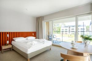 Postel nebo postele na pokoji v ubytování Sea Shell Apartments Łukęcin
