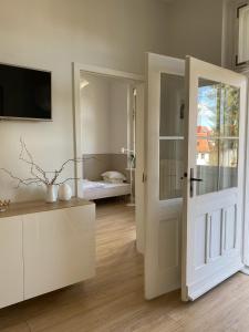 Posteľ alebo postele v izbe v ubytovaní Apartament Parkowy w Polanicy Zdrój
