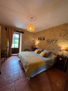 Postel nebo postele na pokoji v ubytování Chambre d'hôtes La Ferme de la Croix.