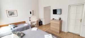 Posteľ alebo postele v izbe v ubytovaní Budapest Csaszar Hotel