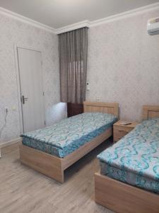 Postel nebo postele na pokoji v ubytování Gegidze 24