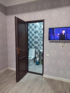 TV a/nebo společenská místnost v ubytování Gegidze 24