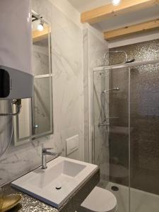 a bathroom with a sink and a shower at Apartment Rose Cres 4 in Cres