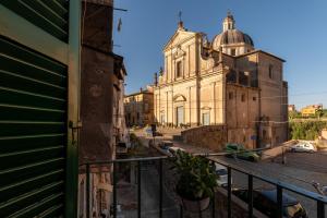 a view of a building from a balcony at Green Home in Ronciglione +14 photos