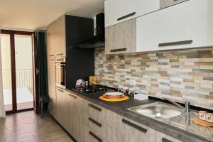 a kitchen with a sink and a counter top at Like Home in Nocera Superiore