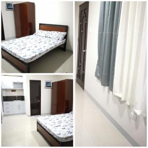 Postel nebo postele na pokoji v ubytování Ermac Residences and Apartelle