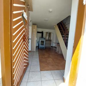 a hallway with a staircase in a house at Ferienparadies Haus Monica in Weikertsham