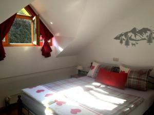 a bedroom with a bed with a mountain mural on the wall at Ferienland Sonnenwald FEWO 46 in Schöfweg