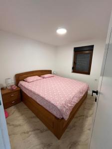 Postel nebo postele na pokoji v ubytování Apartman EM