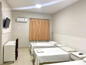 Postel nebo postele na pokoji v ubytování Hotel Rinkao