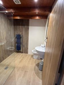 a bathroom with a toilet and a sink at Stewards Bothy in Cornhill-on-tweed +106 photos