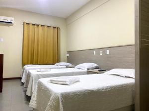 Postel nebo postele na pokoji v ubytování Hotel Rinkao