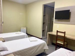 Postel nebo postele na pokoji v ubytování Hotel Rinkao