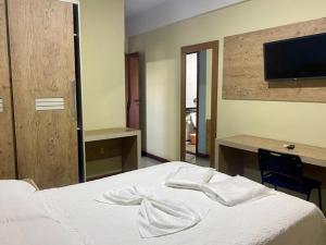 Postel nebo postele na pokoji v ubytování Hotel Rinkao