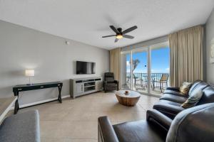 a living room with a couch and a table at Majestic Sun 0303A in Destin