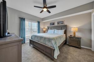 a bedroom with a bed and a ceiling fan at Majestic Sun 0303A in Destin +36 photos