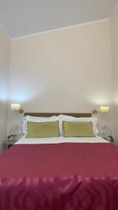 Postel nebo postele na pokoji v ubytování Hotel Maxim Axial