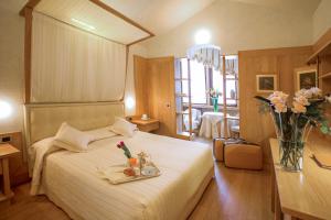 Voodi või voodid majutusasutuse Hotel Spinale toas