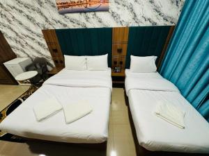 Postel nebo postele na pokoji v ubytování Three Dot Hotel