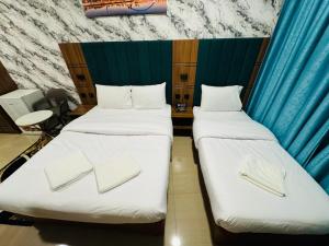 Postel nebo postele na pokoji v ubytování Three Dot Hotel