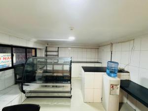 Kuchyň nebo kuchyňský kout v ubytování Three Dot Hotel
