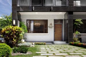 a house with a front door and a walkway at When Happiness Knock your Door in Hualien City
