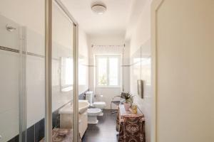 a white bathroom with two toilets and a sink at Casa al Mare - Lido in Terracina +27 photos