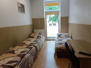 Łóżko lub łóżka w pokoju w obiekcie Pokoje na wynajem Gdańsk