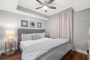 a bedroom with a bed and a ceiling fan at Ariel Dunes II 1106 in Destin +32 photos