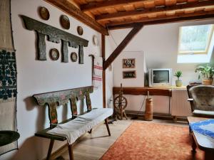 a living room with a couch and a fireplace at Panoráma Panzió Torockó in Rimetea