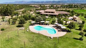 an aerial view of a resort with a swimming pool at Saludi&Trigu - Rural Apartments in Iglesias