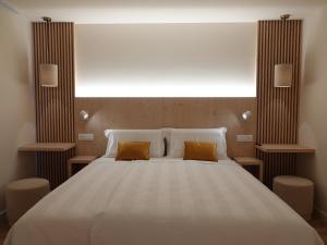 Postel nebo postele na pokoji v ubytování Alpine Rooms and Suites Livigno - Camana Noa -