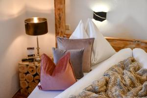 Łóżko lub łóżka w pokoju w obiekcie Boutique Hotel Pinzgauerhof