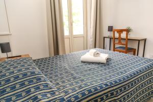 Ένα ή περισσότερα κρεβάτια σε δωμάτιο στο Albergo Athena