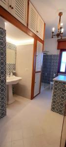 a bathroom with a sink and a mirror at Il Corniolo in Tarquinia +18 photos