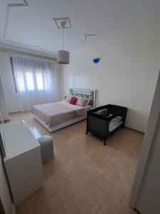 Voodi või voodid majutusasutuse Appartement vue sur mer - Al Hoceima toas