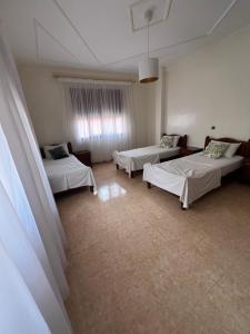 Voodi või voodid majutusasutuse Appartement vue sur mer - Al Hoceima toas