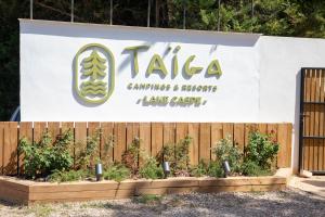 a sign for a garden centre and a fence at TAIGA Lake Caspe in Caspe