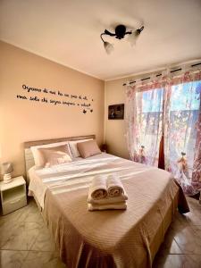 Postel nebo postele na pokoji v ubytování Il Geranio B&B