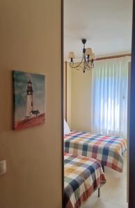 Cama o camas de una habitación en El Jardín de Amos