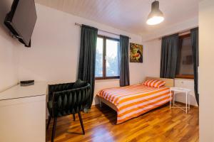 a bedroom with a bed and a window at Apartment Masa - FREE bikes in Premantura