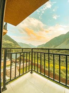 a balcony with a view of the mountains at Hotel Gold Kazbegi in Stepantsminda