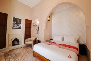 Postel nebo postele na pokoji v ubytování Riad Zi + 37 fotografií
