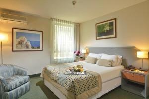 Postel nebo postele na pokoji v ubytování Hotel Eurotel El Bosque